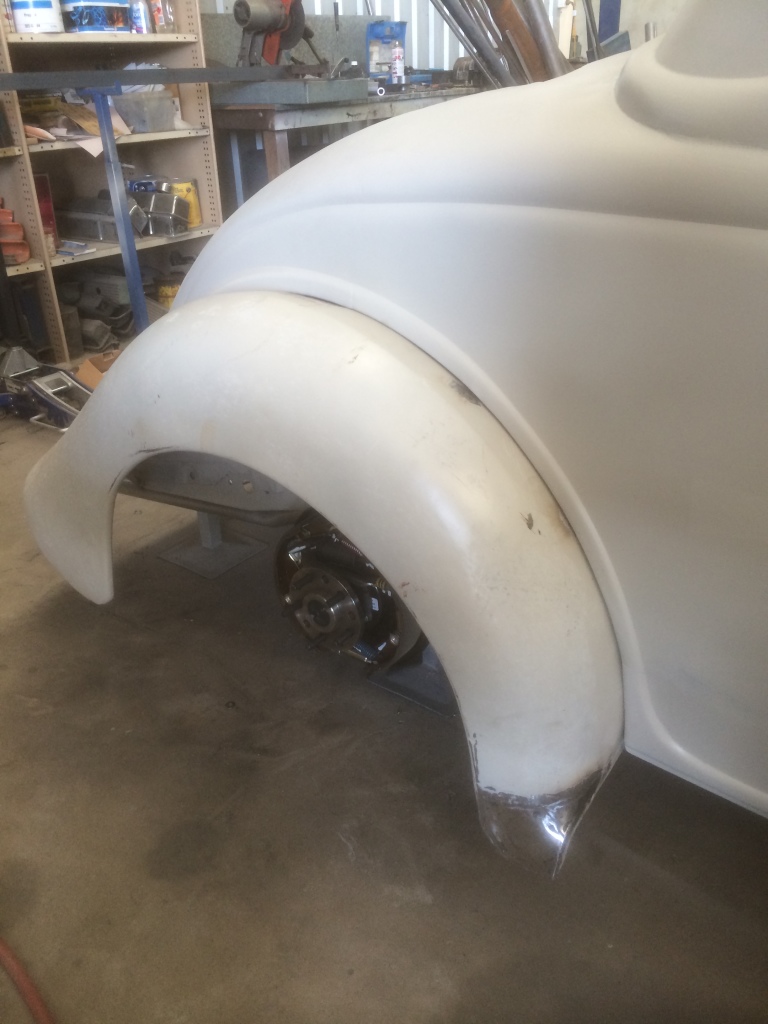 Right rear fender repaired with new lower section fabricated and fitted.